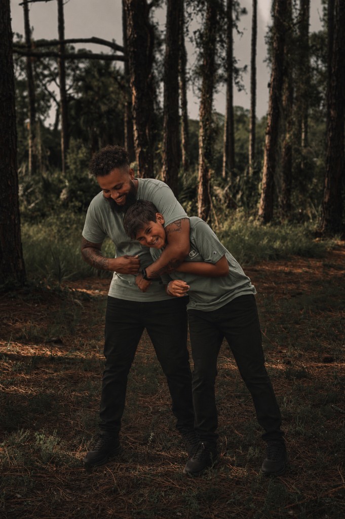 Donte Johnson with his son outdoors — founder of Johnson Home Improvement Services