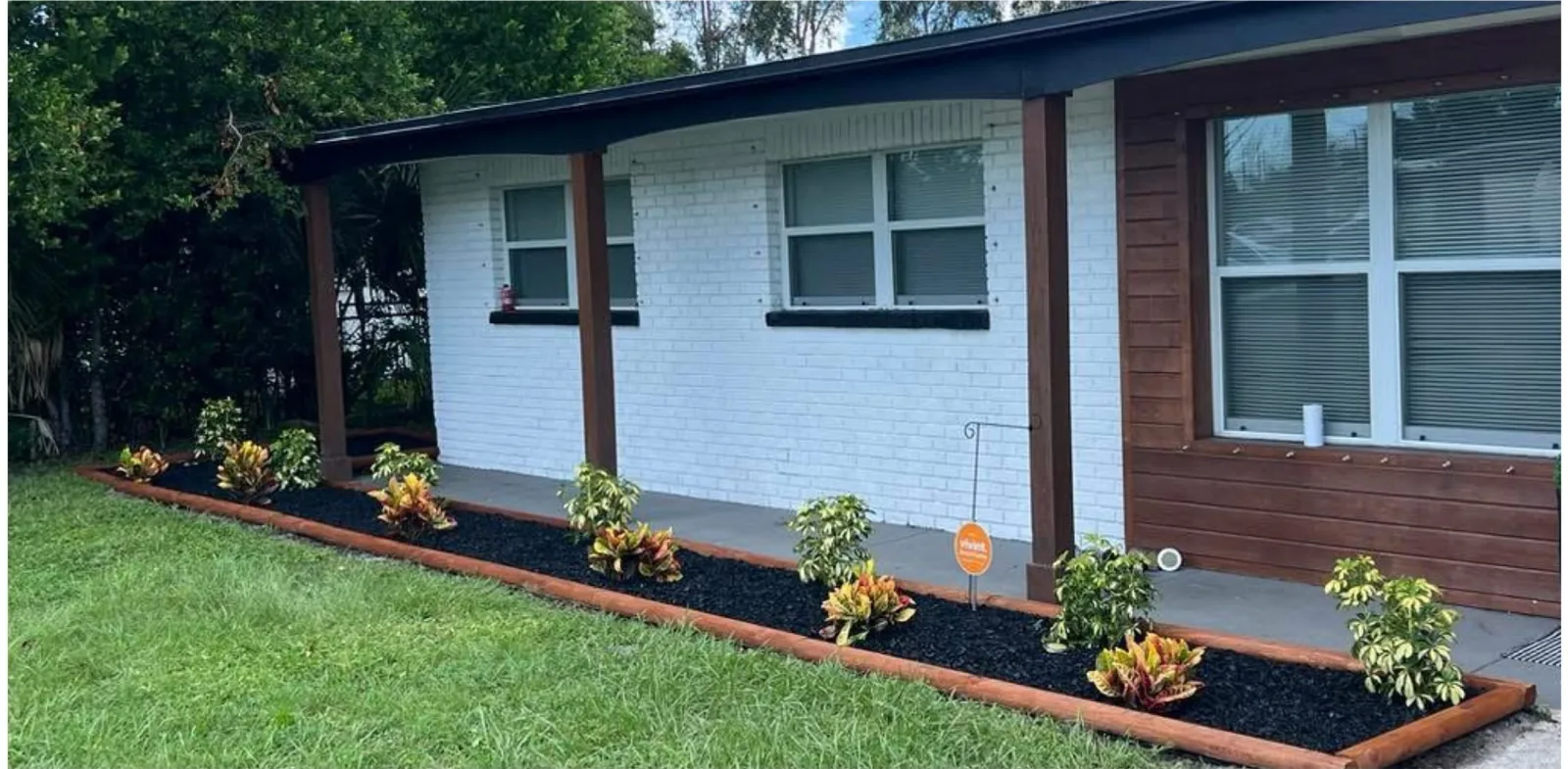 Front Yard Refresh after the work — cut-back planting, clean edges and fresh ground cover