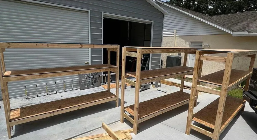 Custom garage shelving built and installed along a wall
