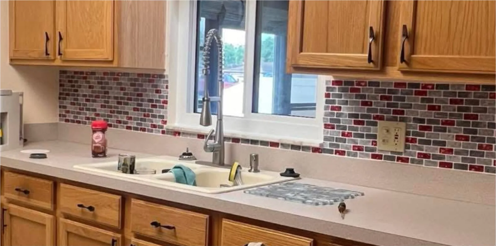 The same view before — bare wall above the counter and a worn work surface