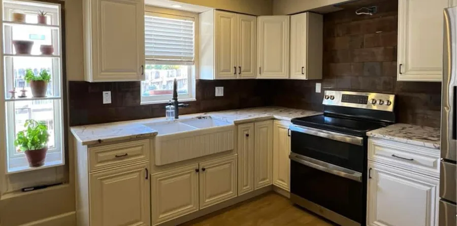 Farmhouse Kitchen Rebuild after the work — a farmhouse-style kitchen with a deep sink and open shelving