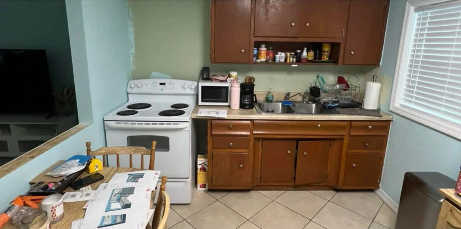 The same view before — dark wood cabinets closing the room in