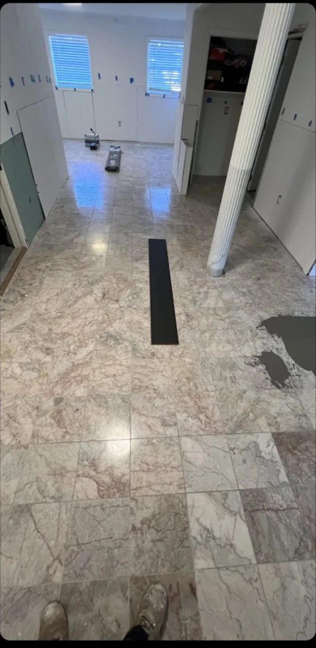 The same view before — worn carpet and uneven subfloor